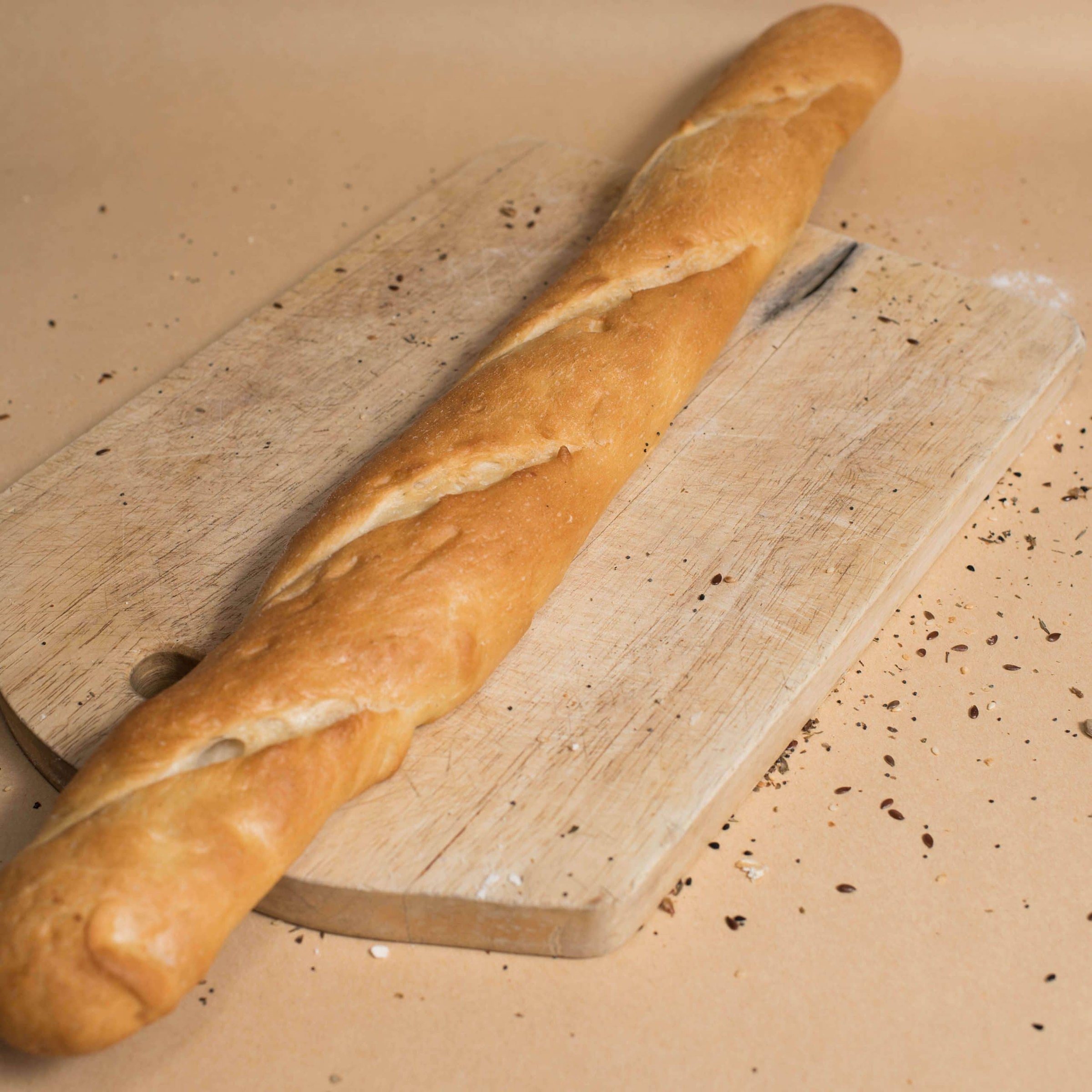 Skinny baguette on a board